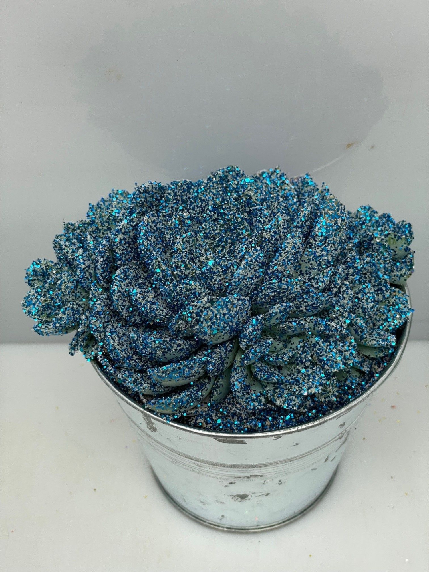 465kerstster BIO Twinkle glitter blauw zinkpot8,5cm, D 9,5 cm